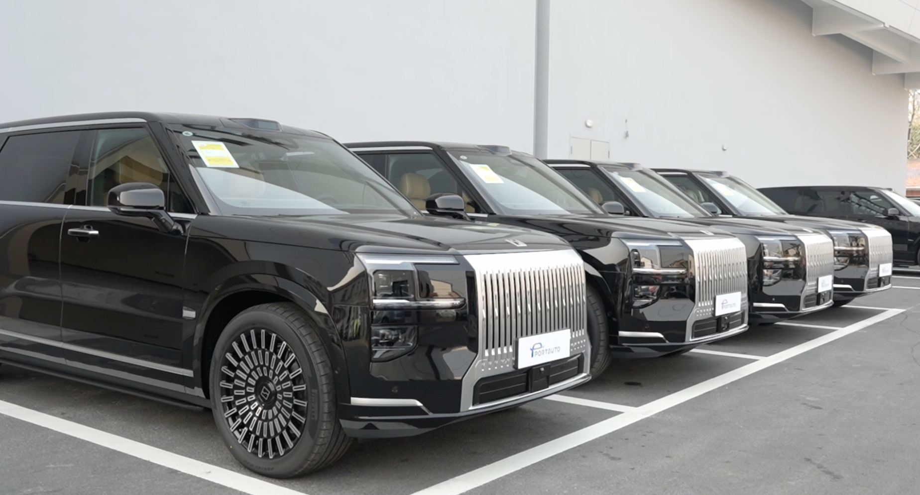 Multi-brand vehicle staging area used as sourcing context.
